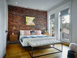 Brick wallpaper in the bedroom interior