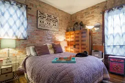 Brick wallpaper in the bedroom interior