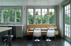 Kitchen design with sofa and table by the window