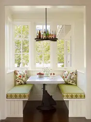 Kitchen design with sofa and table by the window