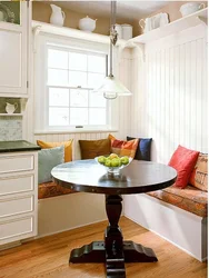 Kitchen design with sofa and table by the window