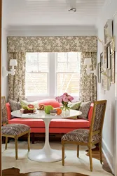 Kitchen design with sofa and table by the window
