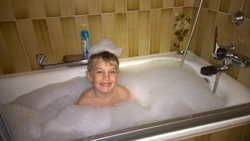 Boy in bath photo