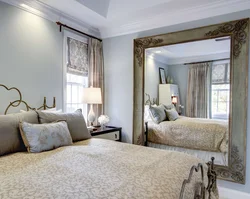 Mirrors opposite the bed in the bedroom photo