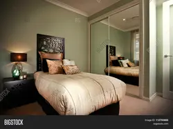 Mirrors opposite the bed in the bedroom photo