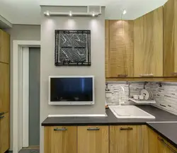 Photo Of A Small Kitchen With A TV
