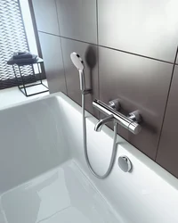 Photo of the bathtub where the faucets are on the bathtub