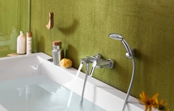 Photo of the bathtub where the faucets are on the bathtub