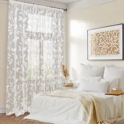 Tulle with flowers in the bedroom interior