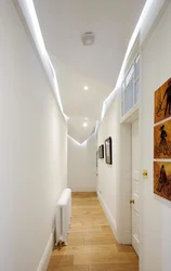 Suspended ceilings in the long corridor of the apartment photo