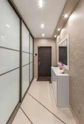 Suspended ceilings in the long corridor of the apartment photo