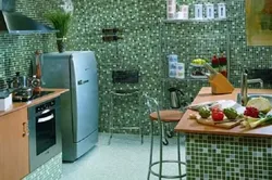 All the walls are tiled in the kitchen photo