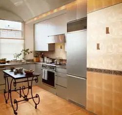 All the walls are tiled in the kitchen photo