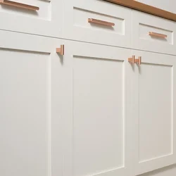 Button handles in the kitchen in the interior