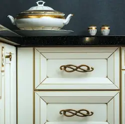 Button handles in the kitchen in the interior