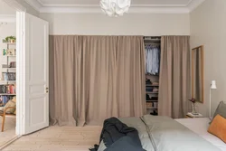 Instead of a door to the dressing room there is a curtain photo of the interior