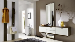 Chest of drawers in the hallway with a mirror in a modern style photo