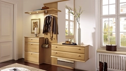 Chest of drawers in the hallway with a mirror in a modern style photo