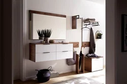 Chest of drawers in the hallway with a mirror in a modern style photo