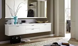 Chest of drawers in the hallway with a mirror in a modern style photo