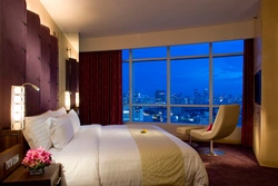 Bedroom design with bed and armchair