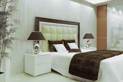 Photo of a bedroom with a bed and bedside tables