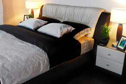 Photo of a bedroom with a bed and bedside tables