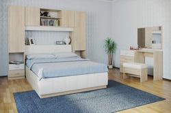 Photo of a bedroom with a bed and bedside tables