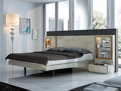 Photo of a bedroom with a bed and bedside tables