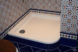 Shower tray in the bathroom interior