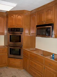 Photo of the kitchen with a stove in the corner