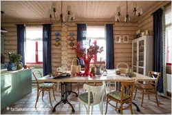 Kitchen in a wooden house made of logs inside photo