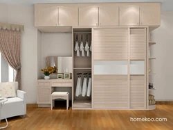 Wardrobe with table in the bedroom photo