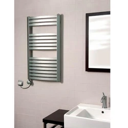Electric heated towel rail for bathtub photo