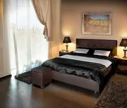 Bedroom with high bed photo