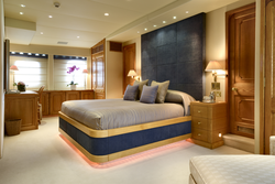 Bedroom with high bed photo