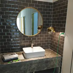 Round mirror in the bathroom photo