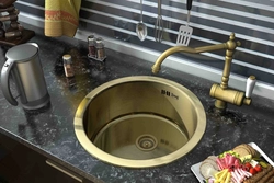 Gold sink in the kitchen photo
