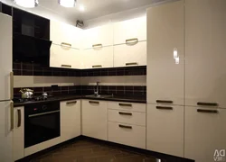 Photo of a kitchen with black handles