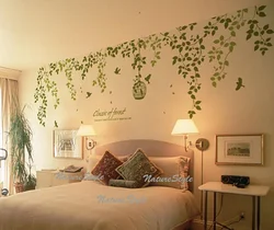 Leaves on the wall in the bedroom interior