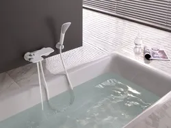 White faucet in the bathroom photo