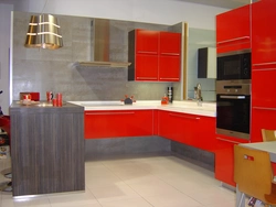 Gray wallpaper and red kitchen interior