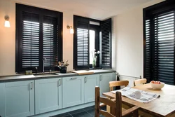 Black windows in the kitchen interior photo