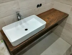 Bathtubs with wooden countertop photo