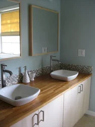 Bathtub design with wooden countertop