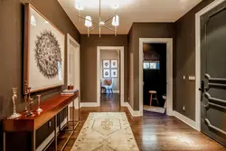 Hallway design with brown wallpaper