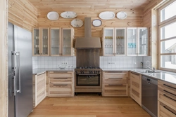 Interior with gray kitchen in a wooden house