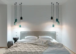 Lamps on the wall in the bedroom in the interior photo