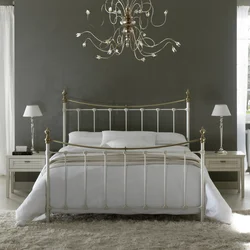 White metal bed in the bedroom interior