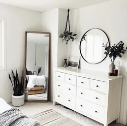 Bedroom design with chest of drawers and mirror photo